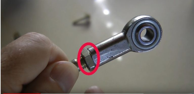 Jam nut securing a rod end in a linkage assembly