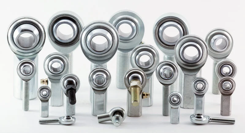 Assorted rod ends in multiple sizes arranged in rows