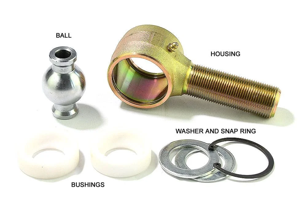 Disassembled johnny joint showing ball, housing, bushings, washer, and snap ring