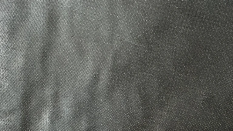 Bronze mesh liner surface for heim joints, featuring woven bronze structure impregnated with PTFE