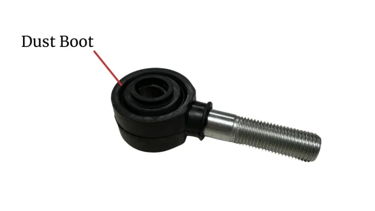 Rod end joint fitted with a dust boot for protection against dirt and debris