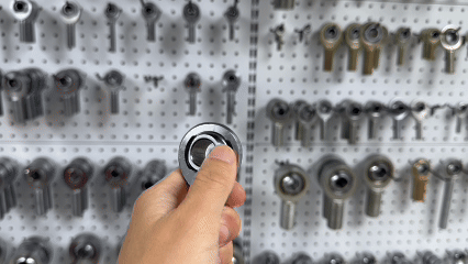 GIF of a rod end where the ball is rotated with the thumb, showing noticeable resistance typical of F2 torque level
