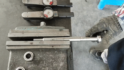 Placing a torque testing fixture with hex head on the outer race of a spherical bearing