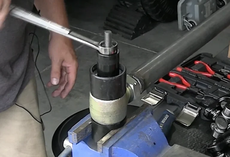 Press the bushing into the housing